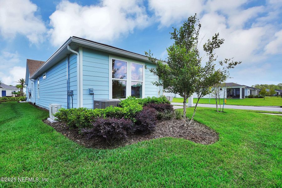 Front exterior of a new home in Summer Bay at Grand Oaks, St. Augustine, FL, highlighting curb appeal (Image 24).