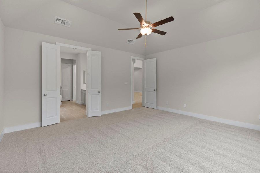 Primary Bedroom with elevated ceiling