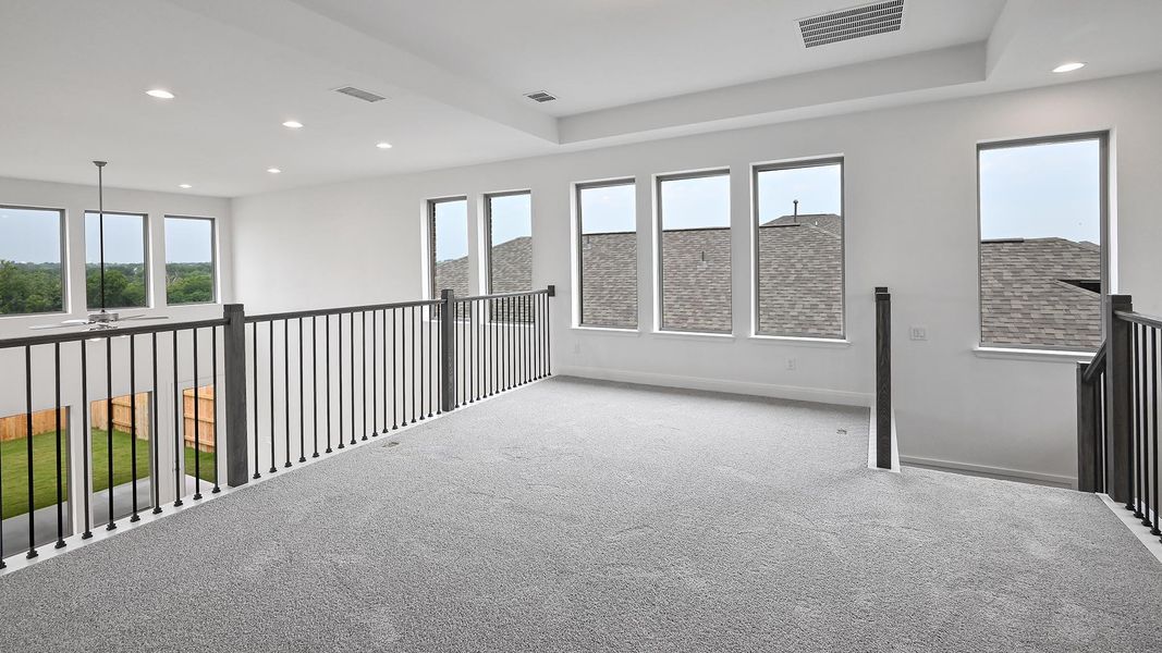 Empty room with carpet flooring, recessed lighting, and baseboards