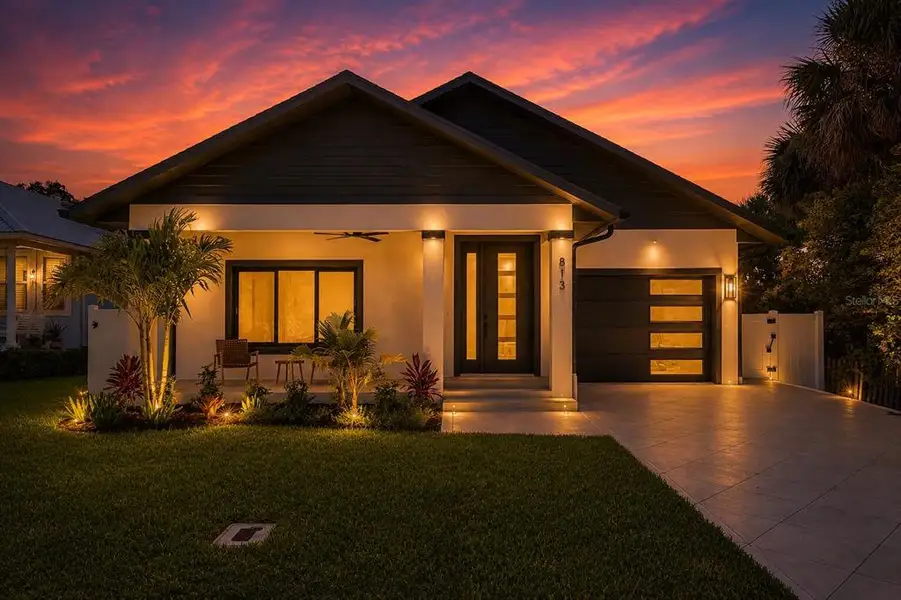 Front exterior of a new home in , New Smyrna Beach, FL, highlighting curb appeal (Image 1). Front exterior of a new home in , New Smyrna Beach, FL, highlighting curb appeal (Image 1).