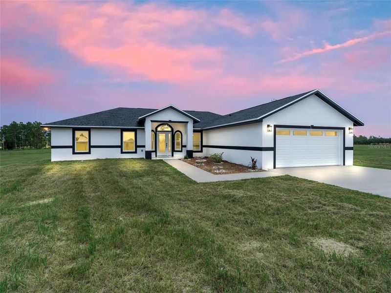 Front exterior of a new home in , Morriston, FL, highlighting curb appeal (Image 2). Front exterior of a new home in , Morriston, FL, highlighting curb appeal (Image 2).