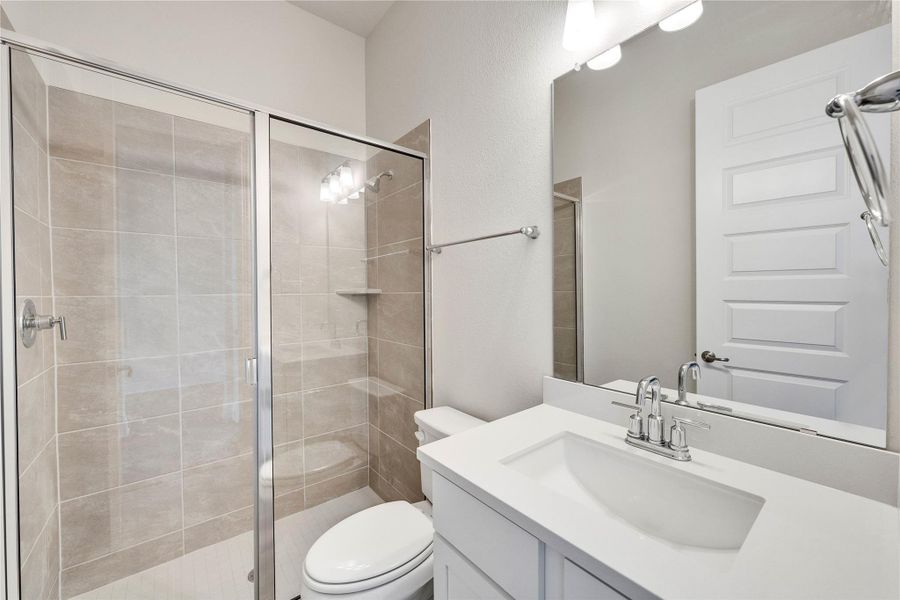 Full bathroom with vanity and a stall shower Full bathroom with vanity and a stall shower