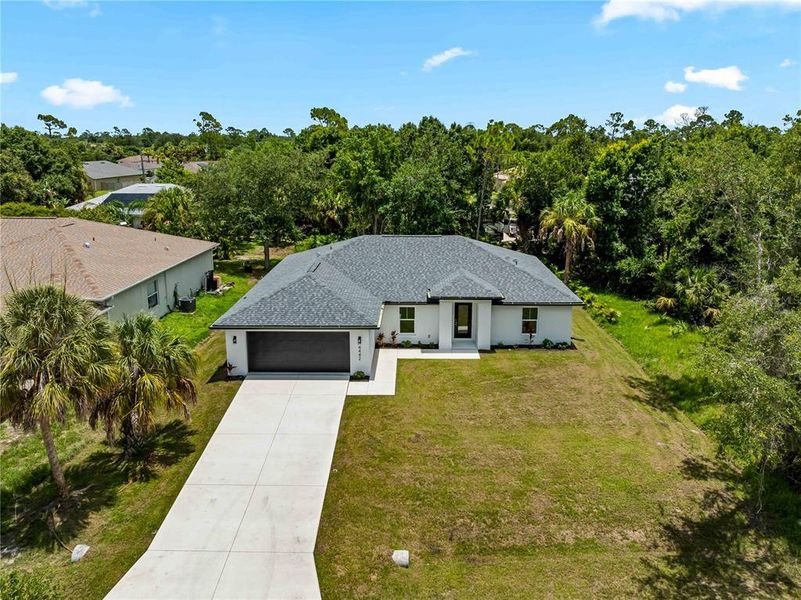 Front exterior of a new home in , North Port, FL, highlighting curb appeal (Image 12).
