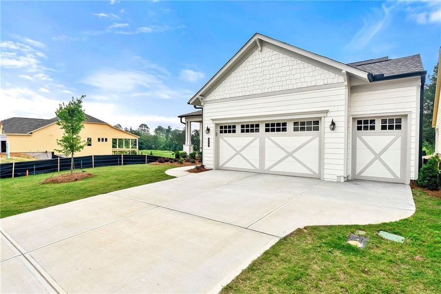 Front exterior of a new home in Cresswind Georgia at Twin Lakes, Hoschton, GA, highlighting curb appeal (Image 1).