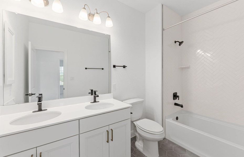 Furnished interior view inside a new home in West Cypress Hills, Spicewood (Image 4).