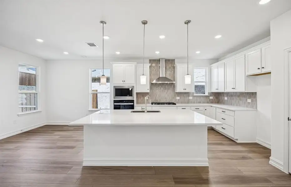Spacious kitchen with eat-in bartop island Spacious kitchen with eat-in bartop island