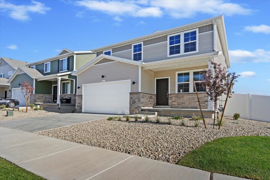 Representative exterior photo of a completed home built from the Triumph by Oakwood Homes Co in Banning Lewis Ranch, Colorado Springs, CO (Image 1). Representative exterior photo of a completed home built from the Triumph by Oakwood Homes Co in Banning Lewis Ranch, Colorado Springs, CO (Image 1).