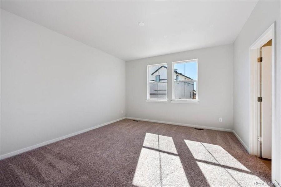 Spacious, unfurnished interior of a new home in The Boulevard II Collection at Windler, Aurora (Image 10).