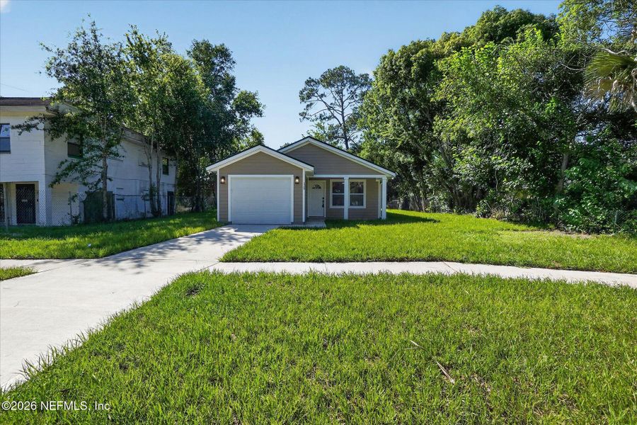 Front exterior of a new home in , Jacksonville, FL, highlighting curb appeal (Image 19).