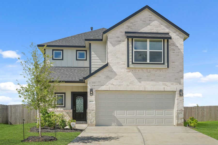 Front exterior of a new home in Grand Oaks Village, Houston, TX, highlighting curb appeal (Image 14). Front exterior of a new home in Grand Oaks Village, Houston, TX, highlighting curb appeal (Image 14).
