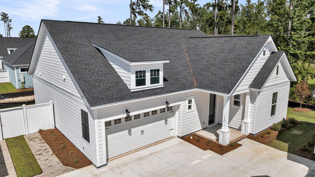 Front exterior of a new home in Nexton – Midtown – The Garden Collection, Summerville, SC, highlighting curb appeal (Image 19).