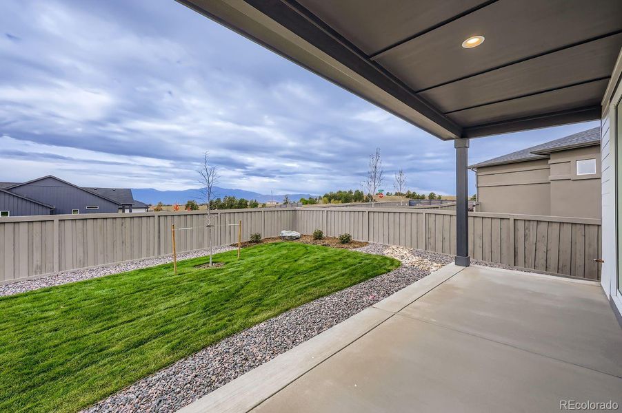 Exterior details and patio area of a home in Sterling Ranch Homestead 60s, Colorado Springs (Image 20).