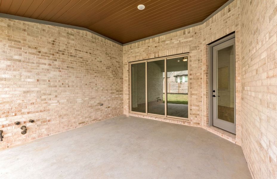 Exterior details and patio area of a home in Bluffview Reserve, Leander (Image 34).