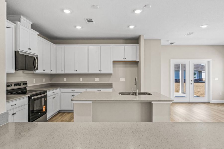 Furnished interior view inside a new home in Natureview, Freeport (Image 9).