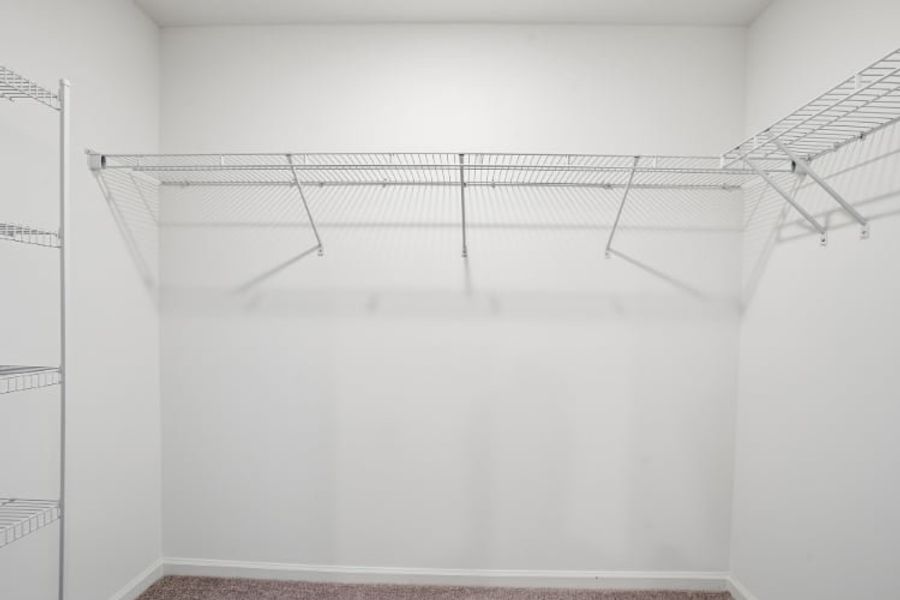 A white room with a metal railing.