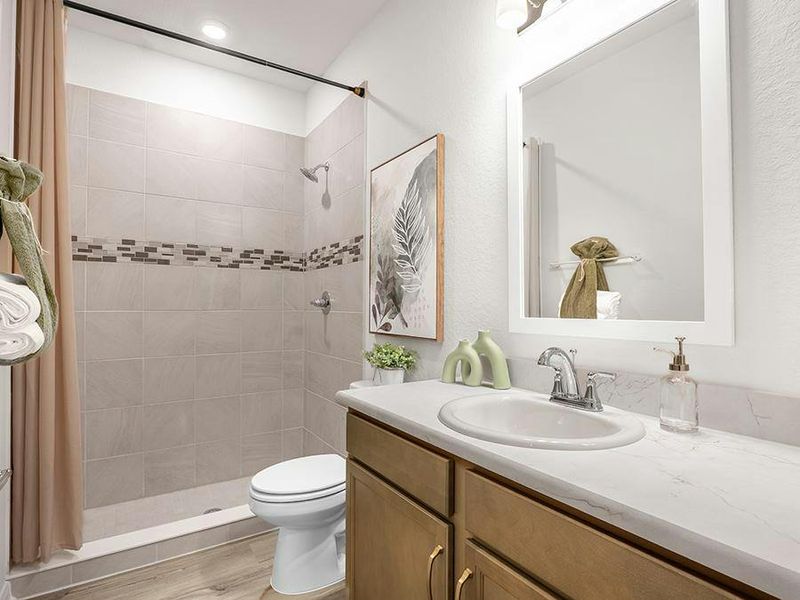 Bath 3 is located next to bedroom 3 - Monroe by Highland Homes
