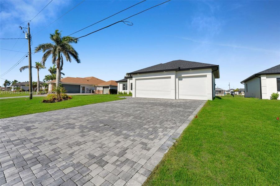 Front exterior of a new home in , Cape Coral, FL, highlighting curb appeal (Image 22). Front exterior of a new home in , Cape Coral, FL, highlighting curb appeal (Image 22).