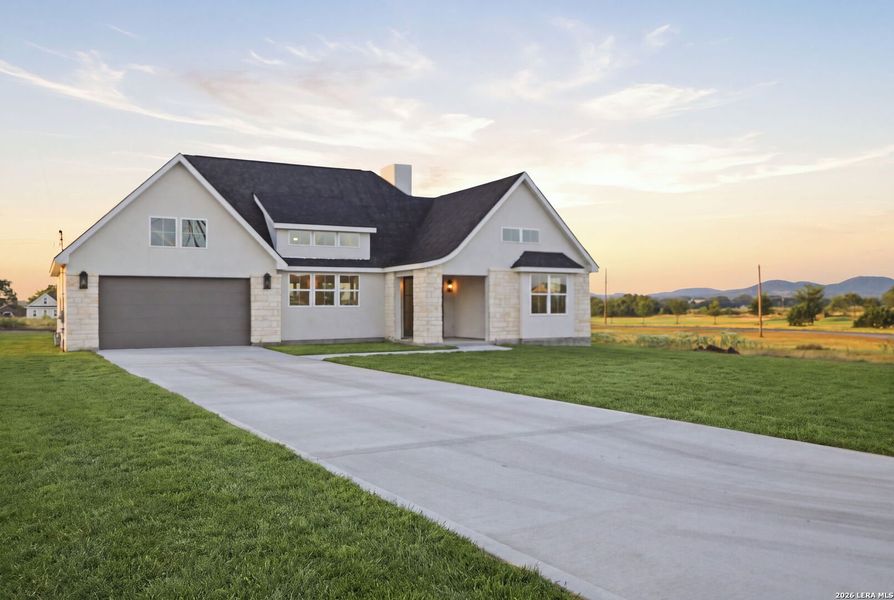 Front exterior of a new home in , Bandera, TX, highlighting curb appeal (Image 2). Front exterior of a new home in , Bandera, TX, highlighting curb appeal (Image 2).