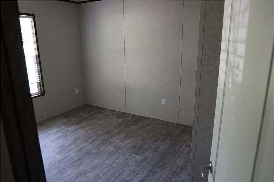 Spare room with hardwood / wood-style floors