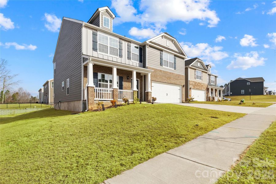 Front exterior of a new home in Adair Woods, Davidson, NC, highlighting curb appeal (Image 28). Front exterior of a new home in Adair Woods, Davidson, NC, highlighting curb appeal (Image 28).