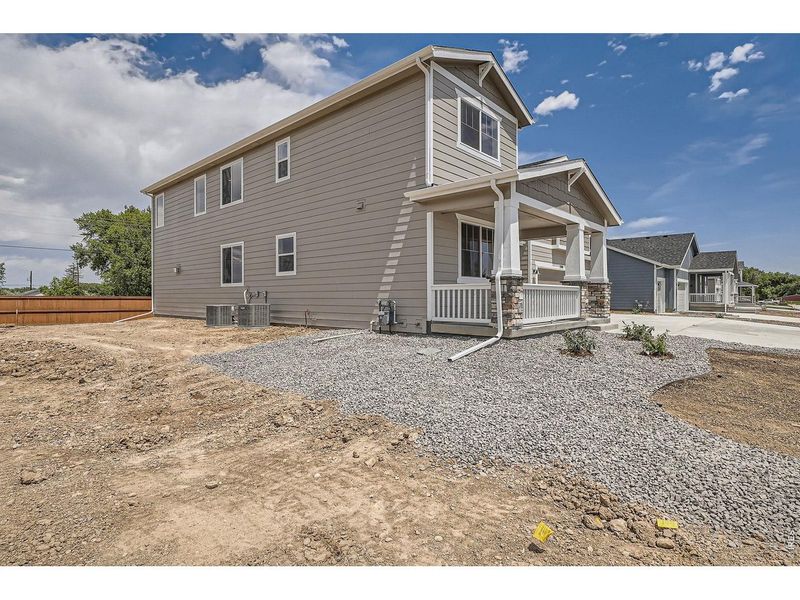 Exterior details and patio area of a home in Farmstead, Berthoud (Image 27).
