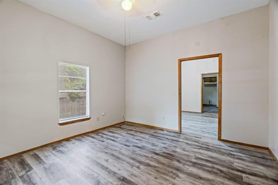 Spare room featuring wood finished floors Spare room featuring wood finished floors