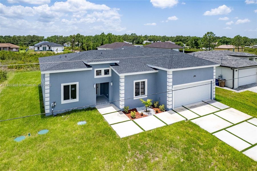 Front exterior of a new home in , Lehigh Acres, FL, highlighting curb appeal (Image 2). Front exterior of a new home in , Lehigh Acres, FL, highlighting curb appeal (Image 2).