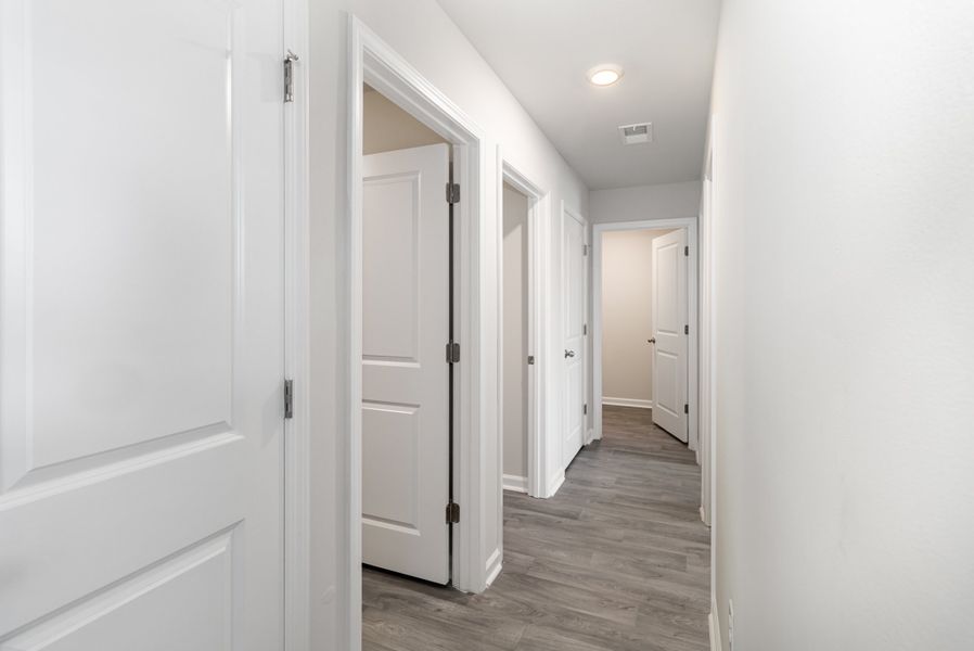 Representative unfurnished interior of a home built from the CURTIS by D.R. Horton in Cottonwood Place, Tabor City (Image 8). Representative unfurnished interior of a home built from the CURTIS by D.R. Horton in Cottonwood Place, Tabor City (Image 8).