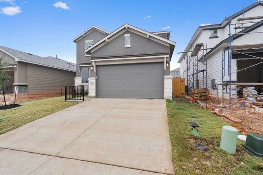 Front exterior of a new home in Morningstar, Georgetown, TX, highlighting curb appeal (Image 6).