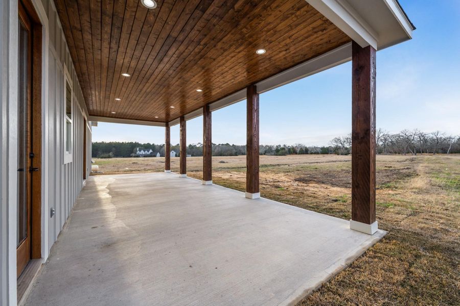 Exterior details and patio area of a home in , New Waverly (Image 29).