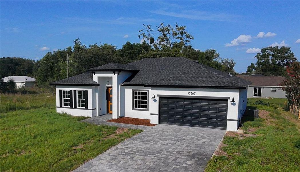 Front exterior of a new home in , Ocala, FL, highlighting curb appeal (Image 17). Front exterior of a new home in , Ocala, FL, highlighting curb appeal (Image 17).