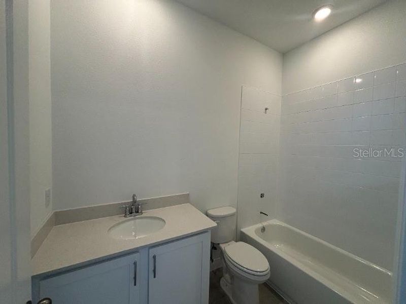 Furnished interior view inside a new home in Ardisia Park Estate, New Smyrna Beach (Image 10).