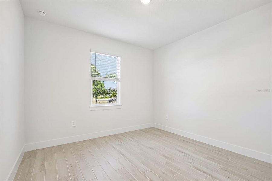 Spacious, unfurnished interior of a new home in Magnolia Bay - Reserve Series, Nokomis (Image 15).