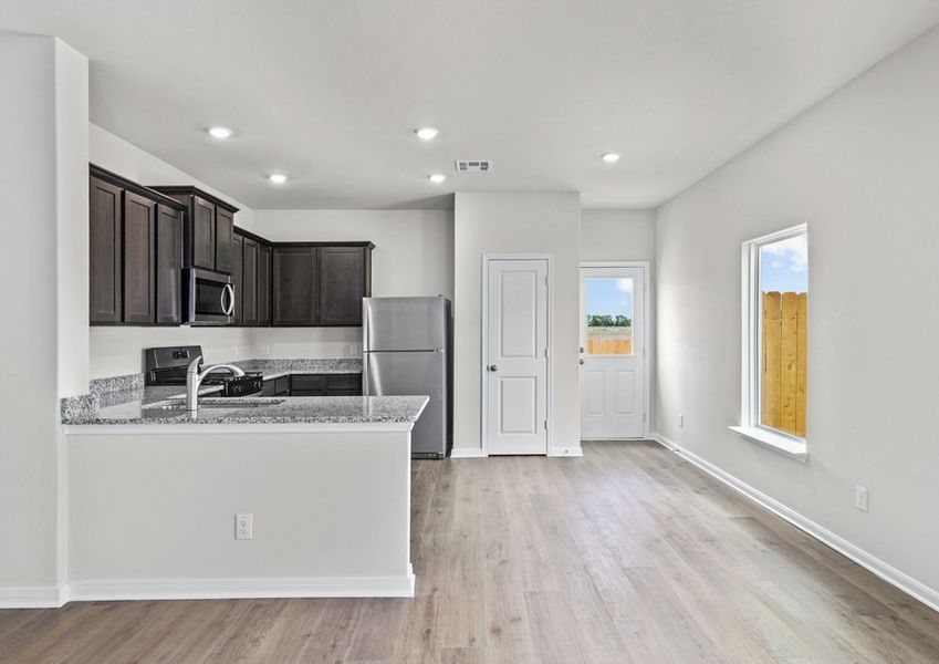 The dining room sits adjacent to the kitchen.