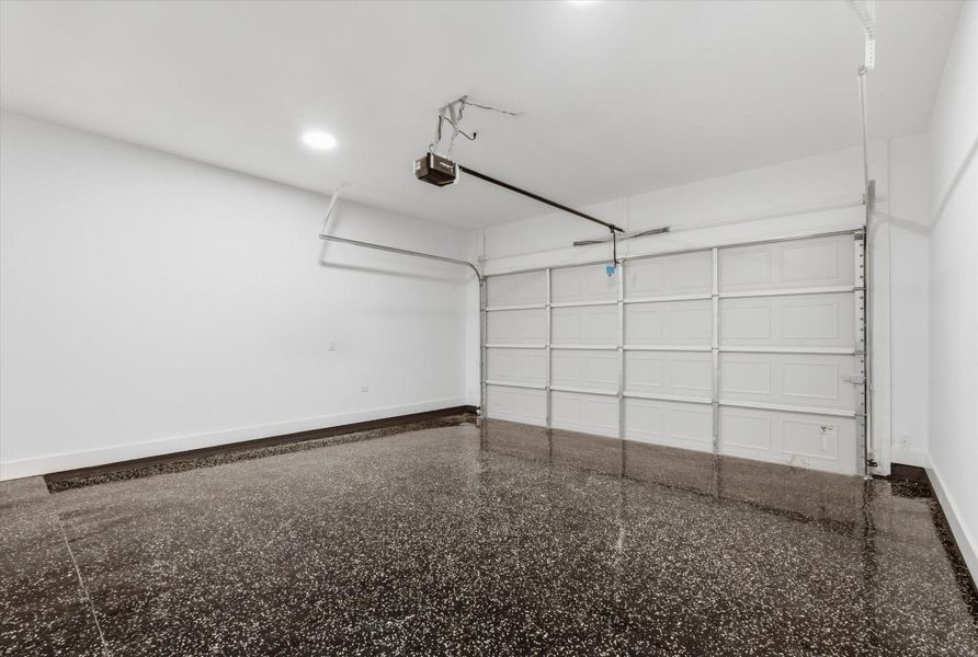The two car garage is finished with epoxy flooring and includes an automatic door opener.