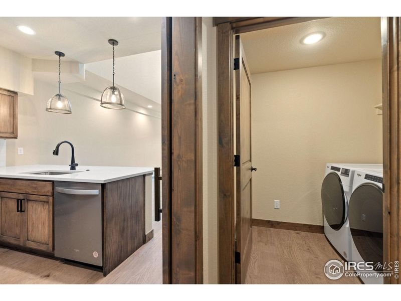 Main level laundry room with washer and dryer included