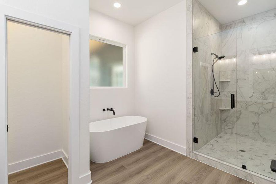 Bathroom - Walk-in shower, a freestanding tub, and recessed lighting