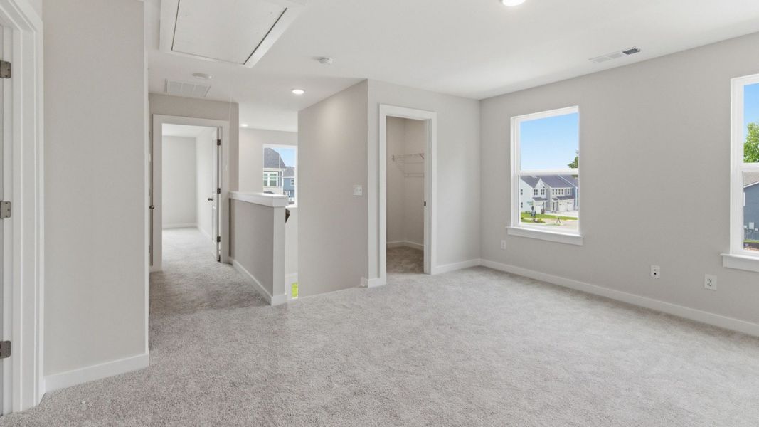 Loft with carpet and windows