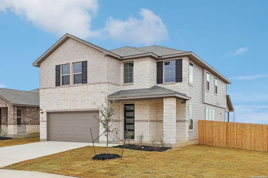 Front exterior of a new home in Lark Canyon, New Braunfels, TX, highlighting curb appeal (Image 23).