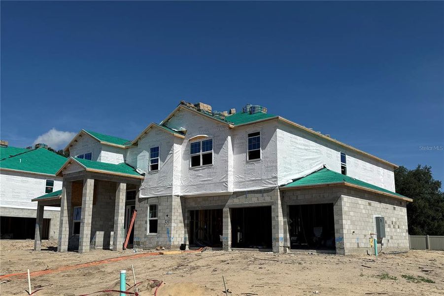 Front exterior of a new home in Willow Run, Apopka, FL, highlighting curb appeal (Image 16).