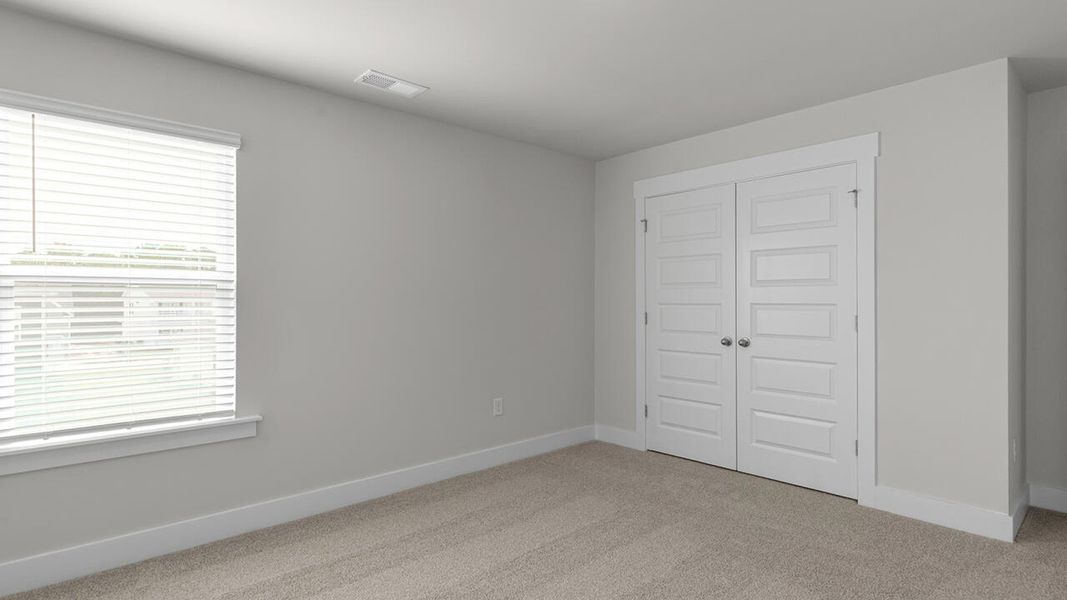 Spacious, unfurnished interior of a new home in Surfside Landing, Hubert (Image 39).