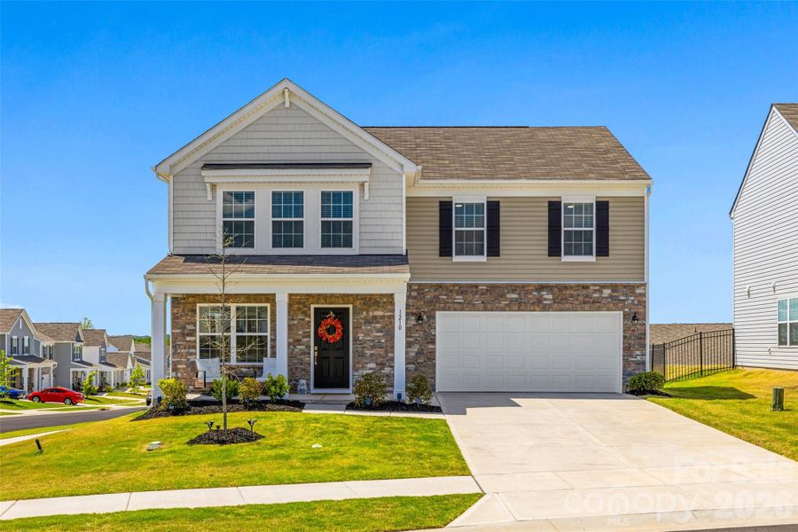 Front exterior of a new home in Walkers Mill, Edgemoor, SC, highlighting curb appeal (Image 2). Front exterior of a new home in Walkers Mill, Edgemoor, SC, highlighting curb appeal (Image 2).