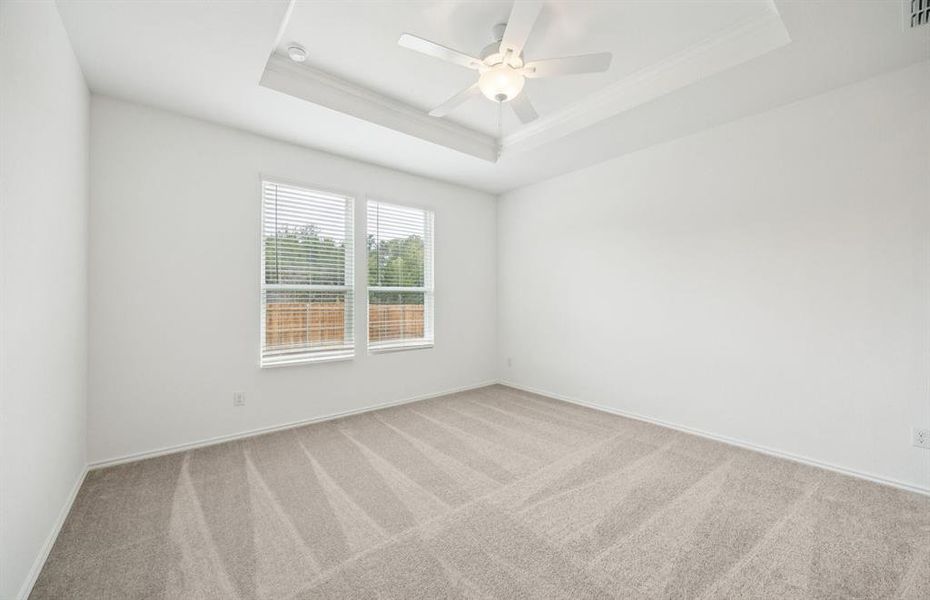 Spacious owner's suite highlighted by large windows and an exquisite tray ceiling Spacious owner's suite highlighted by large windows and an exquisite tray ceiling