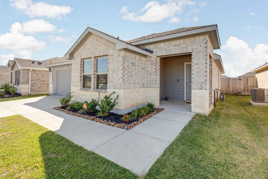 Front exterior of a new home in , Navasota, TX, highlighting curb appeal (Image 21).