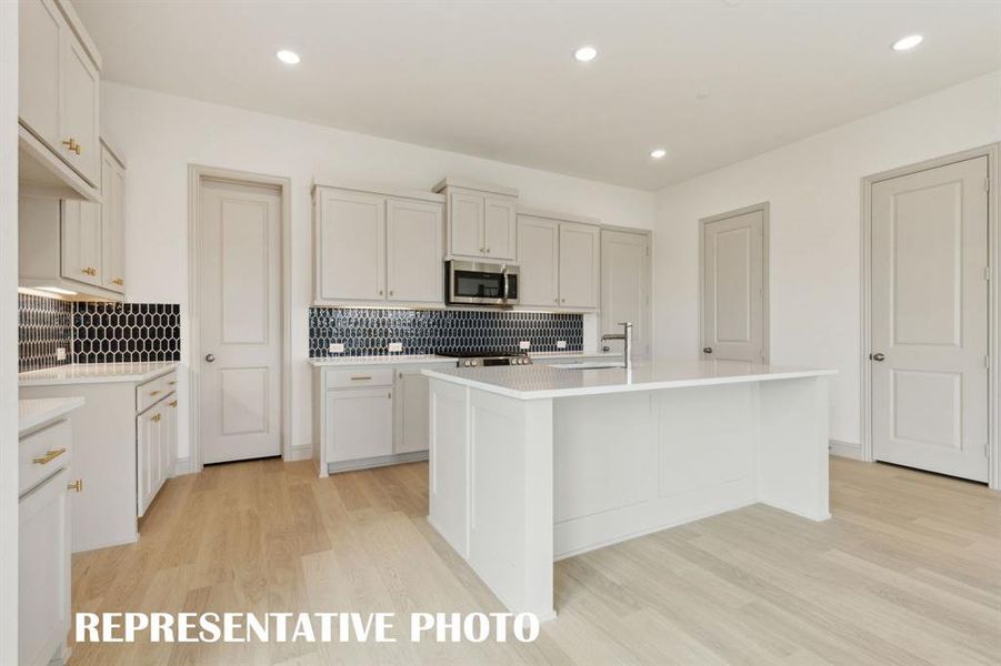 The beautiful kitchen island is the perfect place for friends & family to gather round. The beautiful kitchen island is the perfect place for friends & family to gather round.