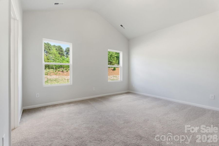 Primary Bedroom with Vaulted Ceiling