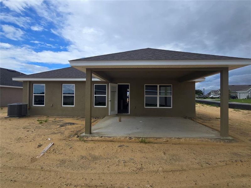 Front exterior of a new home in Twisted Oaks, Beverly Hills, FL, highlighting curb appeal (Image 16).