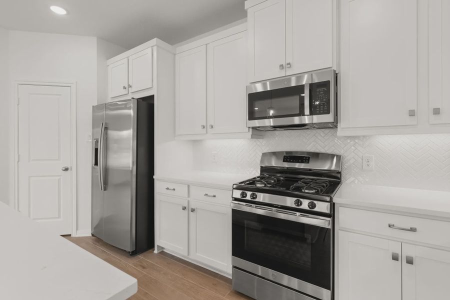 Representative furnished interior of a home built from the Chalet by Chesmar Homes in Woodforest, Montgomery (Image 4).