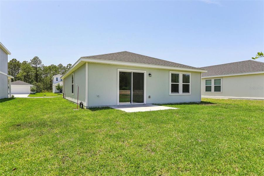 Exterior details and patio area of a home in Flagler Village - Classic Series, Palm Coast (Image 4).