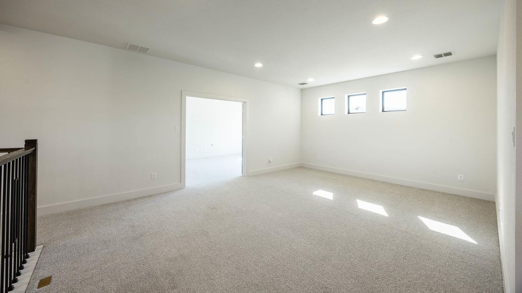 Spare room featuring recessed lighting and light colored carpet Spare room featuring recessed lighting and light colored carpet